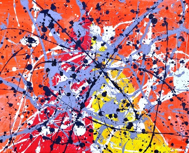colorful paint randomly splattered on a canvas
